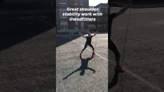Reed sothoron is using the WODFitters resistance band for the shoulder stability.