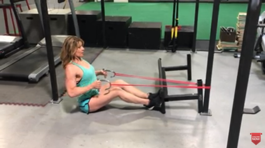 WODFitters Resistance Red Bands using for seated lats rowing Excercise